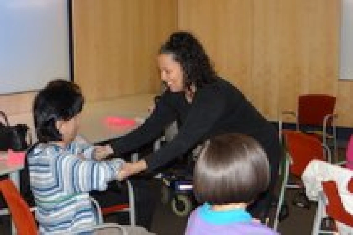 woman teaching children yoga